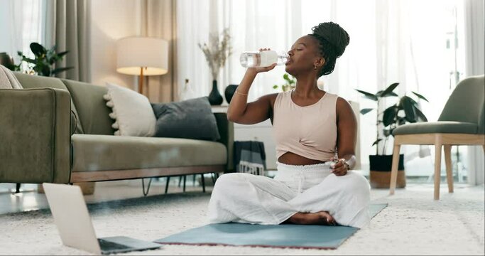 Drinking water, yoga or black woman in home with health, fitness or wellness for hydration to relax. Thirsty African person, online laptop tutorial or healthy lady with liquid after exercise training