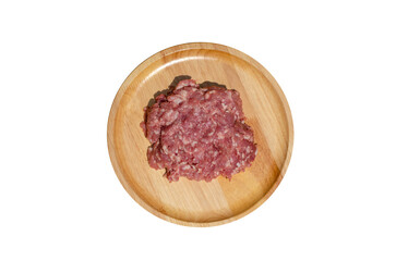 Raw fresh minced pork on a wooden plate on transparent background, Top view