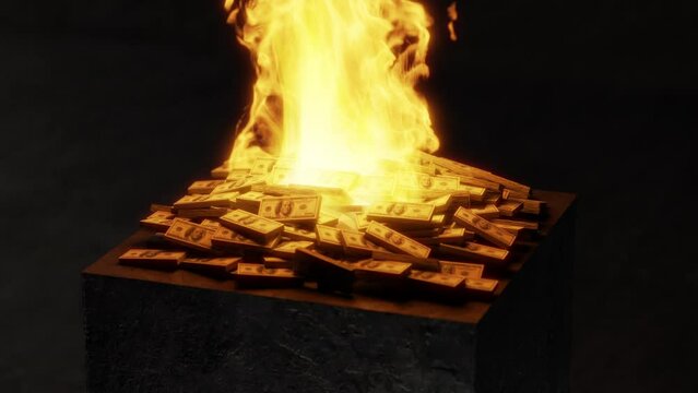 Pile of dollars burning on a black block