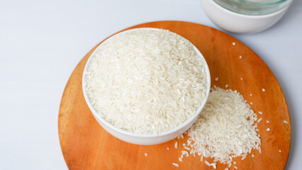 photo of white rice on white bowl, isolated on white background.