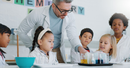 Chemistry, teacher and students with education, classroom and science with research, conversation and experiment. School, man and children with educator, laboratory or kids with support and questions