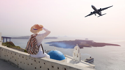 Happy Holiday Young man tourist in a hat and landscape view of Oia town in Santorini island in...