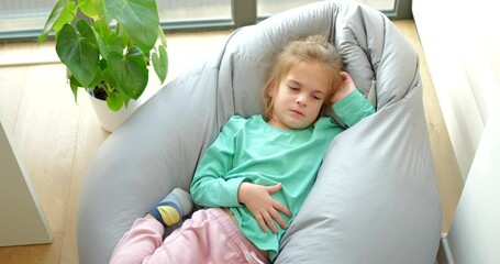 Little girl is suffering from abdominal pain