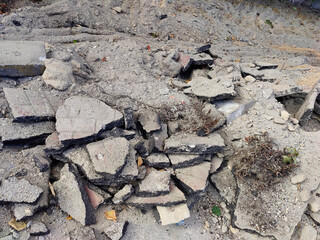 Asphalt pieces, pieces of broken asphalt. Renovation of the asphalt pavement.