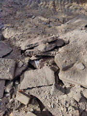 Asphalt pieces, pieces of broken asphalt. Renovation of the asphalt pavement.