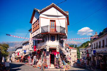 Gjirokaster in Albania- October 2023- Souvenir shops in old town - obrazy, fototapety, plakaty