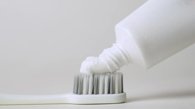 Close up view of toothpaste with toothbrush.