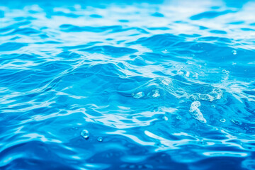 Beautiful natural light blue background with the texture of water waves.