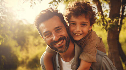 Father and son smiling and hugging in nature with quality time together outdoors. Family love and Father's Day concept.