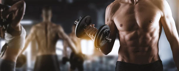 Tuinposter Fitness Fit muscular man working out at the gym