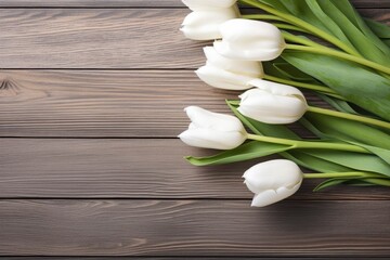 Fototapeta na wymiar White tulips on wood table.