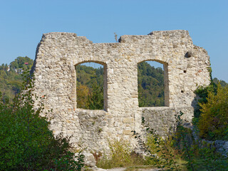 View of the ruins of the stone wall of medieval Samobor Castle on the hill Tepec with a clear blue sky in the background, Samobor, Croatia