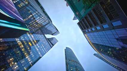 Looking Up in Down town of modern city Skyscrappers With clear skies..