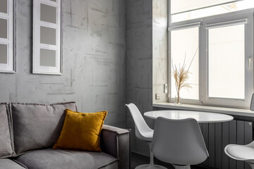 Apartment with white chairs and round wooden, white table