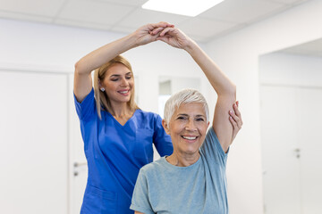 A Modern rehabilitation physiotherapy worker with senior client. Physiotherapist working with...