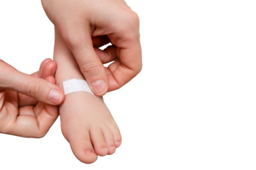Mother woman sticks a medical adhesive plaster on the toddler baby leg, isolated on a white background. Mom s hand with sticky wound protection tape and child foot. Kid aged one year and three months