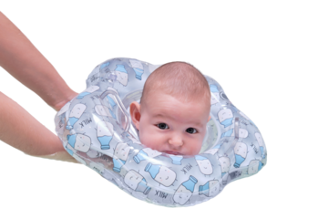 Infant swimming of a newborn baby in a home bathroom, the child swims with an inflatable circle around his neck. A boy aged two months with the help of his mother is bathing in the bath