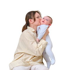 Happy woman mother kissing her beloved infant baby on the home sofa in the living room, isolated on a white background. Kid aged six months