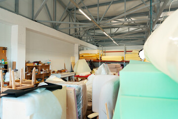 Stacked materials for furniture upholstery in furniture factory