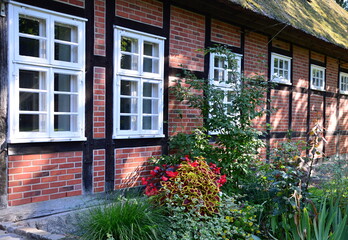 Fototapeta na wymiar Historical Farm in the Town Neuenkirchen, Lower Saxony