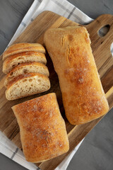 Homemade Ciabatta Bread on a wooden board, top view. Flat lay, overhead, from above.
