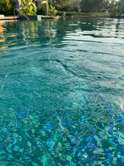 Clear rippled water in outdoor swimming pool