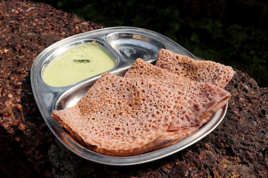 Ragi Ghavne and chutney, or Neer Dosa, is a popular breakfast dish from the Konkani or South Indian cuisine. Ghavne is a thin and delicate raagi crepe served with spicy coconut  chutney. 