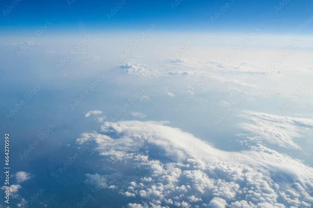 Wall mural a cloud photographed in the sky in an airplane