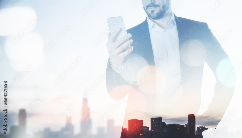 Poster young european businessman with cellphone standing on abstract bokeh city background with light mock
