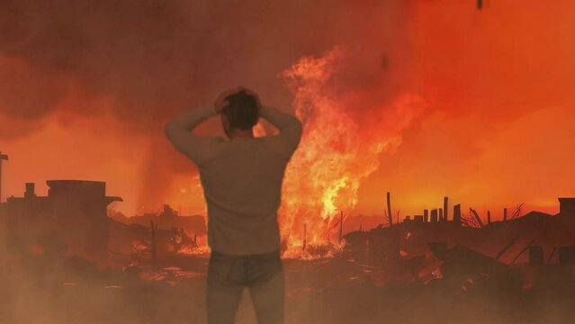 Back view A man standing on a road of burnt up city. Apocalyptic view of city downtown. Ruined city in fire.