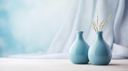 Blue ceramic vases on textured cloth Home decor Copy space Selective focus