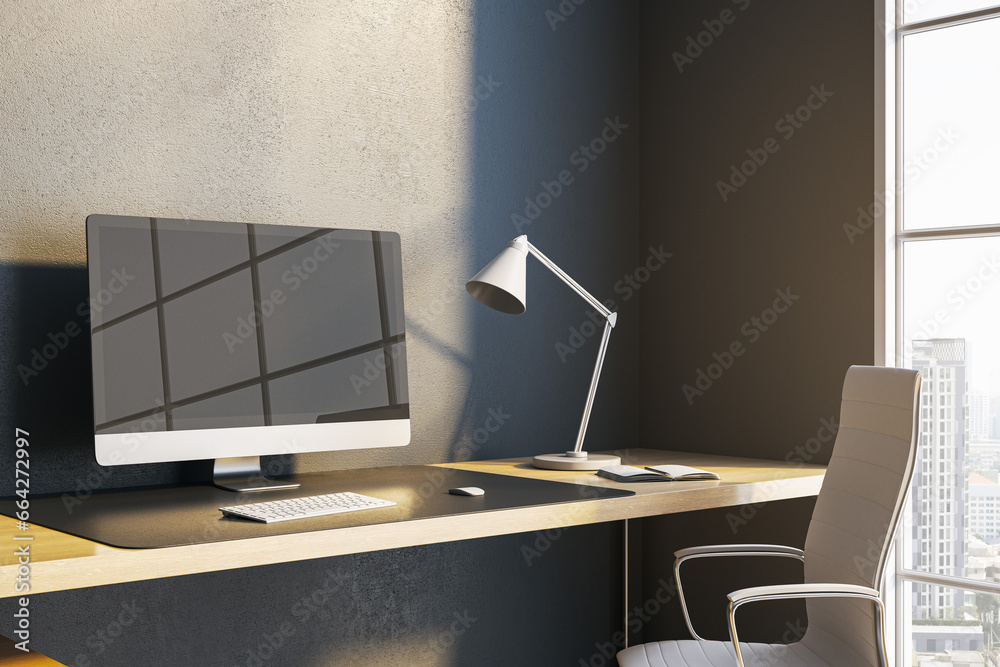Poster Close up of modern desk with reflections on computer monitor, lamp and window with city view and daylight. 3D Rendering.