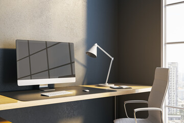 Close up of modern desk with reflections on computer monitor, lamp and window with city view and daylight. 3D Rendering.