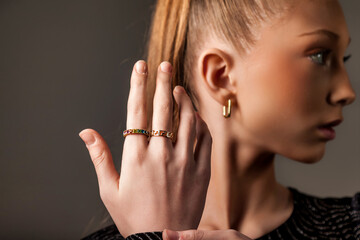Perfect chic teen cover girl model lady 13 year old gesture with hands, looking side away, studio...