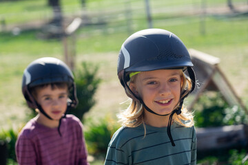 Fototapeta na wymiar Two children happy with riding helmets