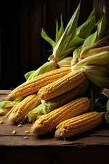 View of fresh corn on wooden table.