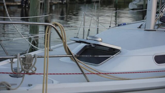 close-up shot of an open hatch on a sailboat docked at a marina. Captures the intricate design and functionality of the hatch, providing a glimpse into the world of sailing and maritime exploration. 