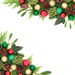 Festive Christmas winter greenery background frame with bauble decorations. Greetings card for the holiday season, Yule, Noel, New Year on white.
