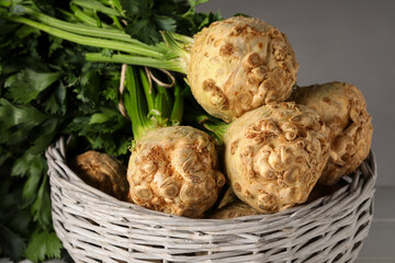 Fresh raw celery roots in wicker basket, closeup