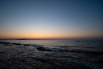 Fototapeta na wymiar Sunset landscape seascape shore in Mediterranean Sea Crete, Greece