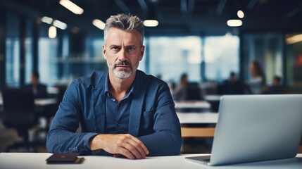A man with a serious look on his face is sitting at a table with an open laptop computer. Fictional characters created by Generated AI.