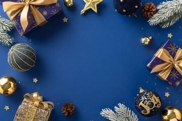 Gift Elegance. Overhead image featuring sparkling blue and gold-wrapped gifts, ornaments, radiant star, glitter, pinecones, frosty evergreen branches against rich blue backdrop for greeting or advert - Powered by Adobe