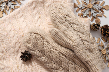 Warm knitted mittens with a sweater and cones