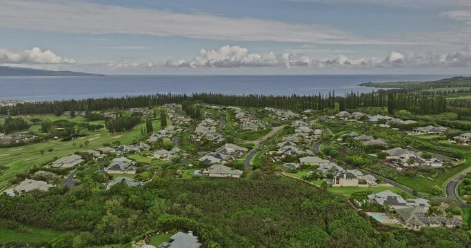 Maui Hawaii Aerial v12 flyover Kapalua Golf Course Resort capturing luxurious homes at Pineapple Hill lush neighborhood overlooking a Molokaʻi and Lanai island - Shot with Mavic 3 Cine - December 2022