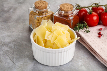 Sliced parmesan cheese in the bowl