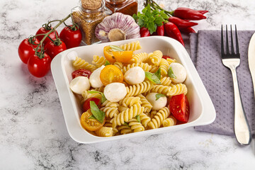 Italian pasta with mozzarella and tomato