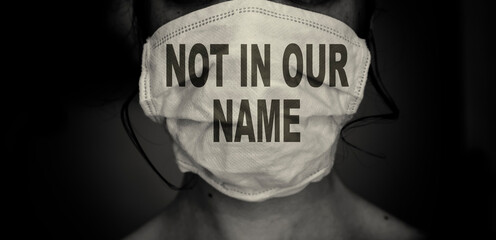 woman wearing a mask with not in our name text. Save gaza concept and jewish voice for peace