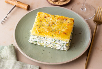 Lasagna with cheese and spinach. Italian food. Vegetarian food.