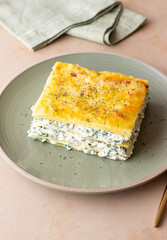 Lasagna with cheese and spinach. Italian food. Vegetarian food.