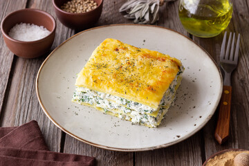 Lasagna with cheese and spinach. Italian food. Vegetarian food.